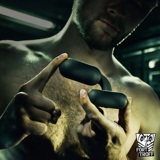 Model holding the Powershift 300 vibrating prostate massager between his fingers, Fort Troff