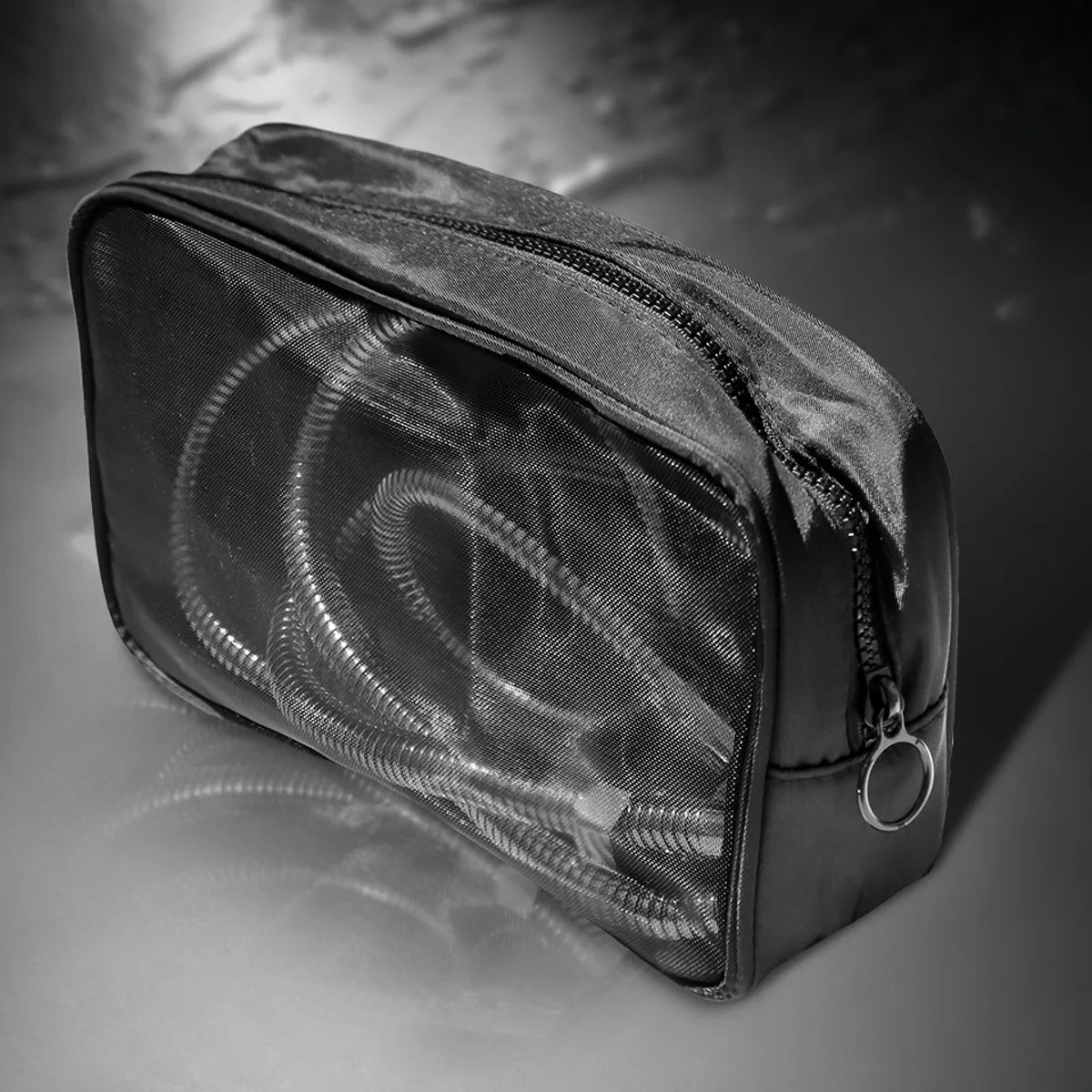 the Apex Shower Set packed into its mesh travel bag with hose and diverter
