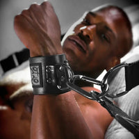 Bed Bondage restraint straps with steel clips at the bed corners. Fort Troff.