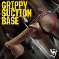 Cut Thruster stuck down by its grippy suction base behind a model in a red jockstrap, Fort Troff