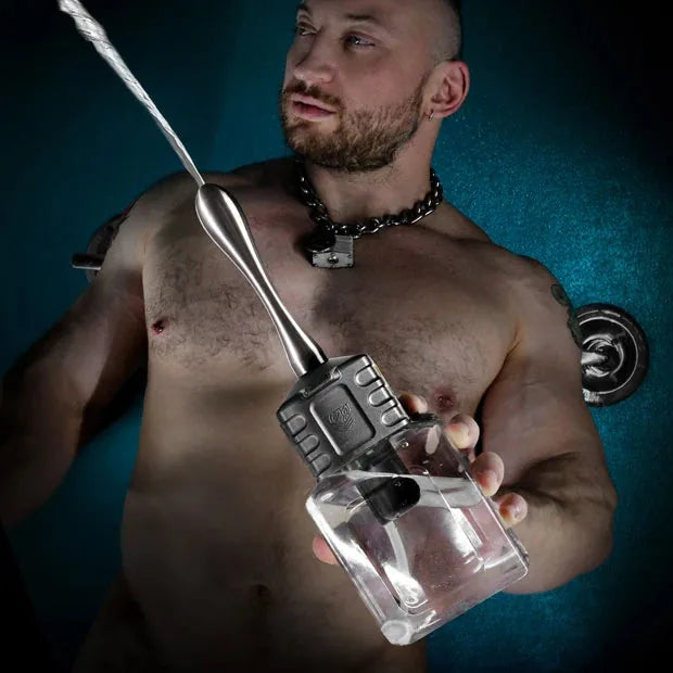 Depth Charge automatic douche held by a shirtless male model, spraying a strong water stream, Fort Troff