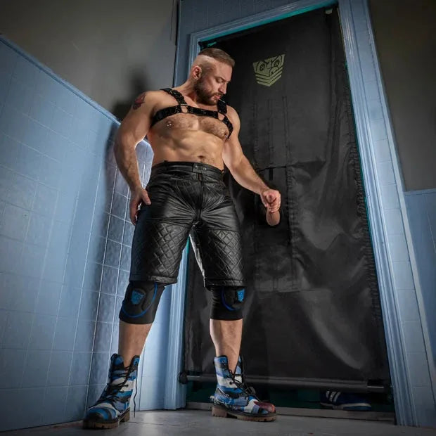 Doorway Glory Hole Kit installed in a bathroom doorway with a harnessed model beside it, Fort Troff