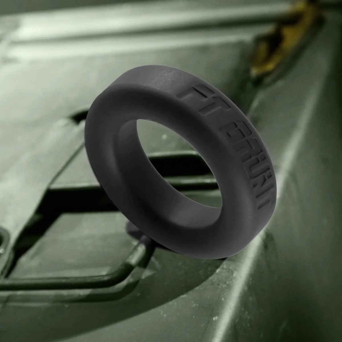 Grunt Ring matte black silicone cock ring on an ammo can, product shot, Fort Troff