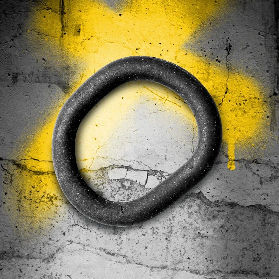 X-Wrap 3-in-1 cush cock ring open loop on concrete with yellow spray-paint X, Fort Troff