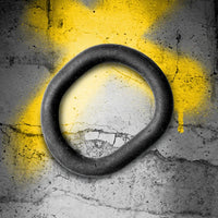X-Wrap 3-in-1 cush cock ring open loop on concrete with yellow spray-paint X, Fort Troff