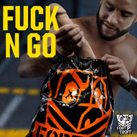 Shirtless bearded model pulling open the drawstring of the Fuck N Go Toy Bag, Fort Troff