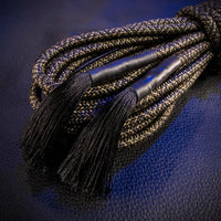 Grunt Rope close-up of sealed, tasseled rope ends and tight braid, Fort Troff