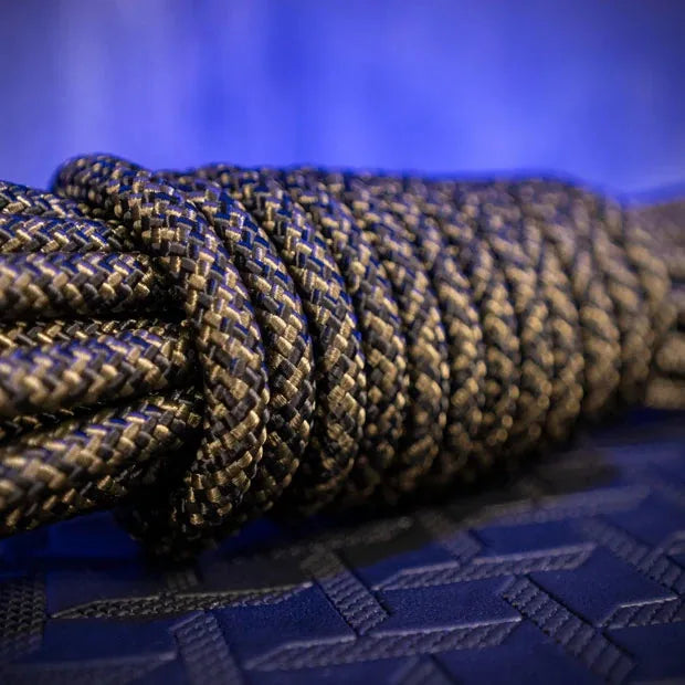 Grunt Rope braided polyester bondage rope macro detail of the olive-black weave, Fort Troff