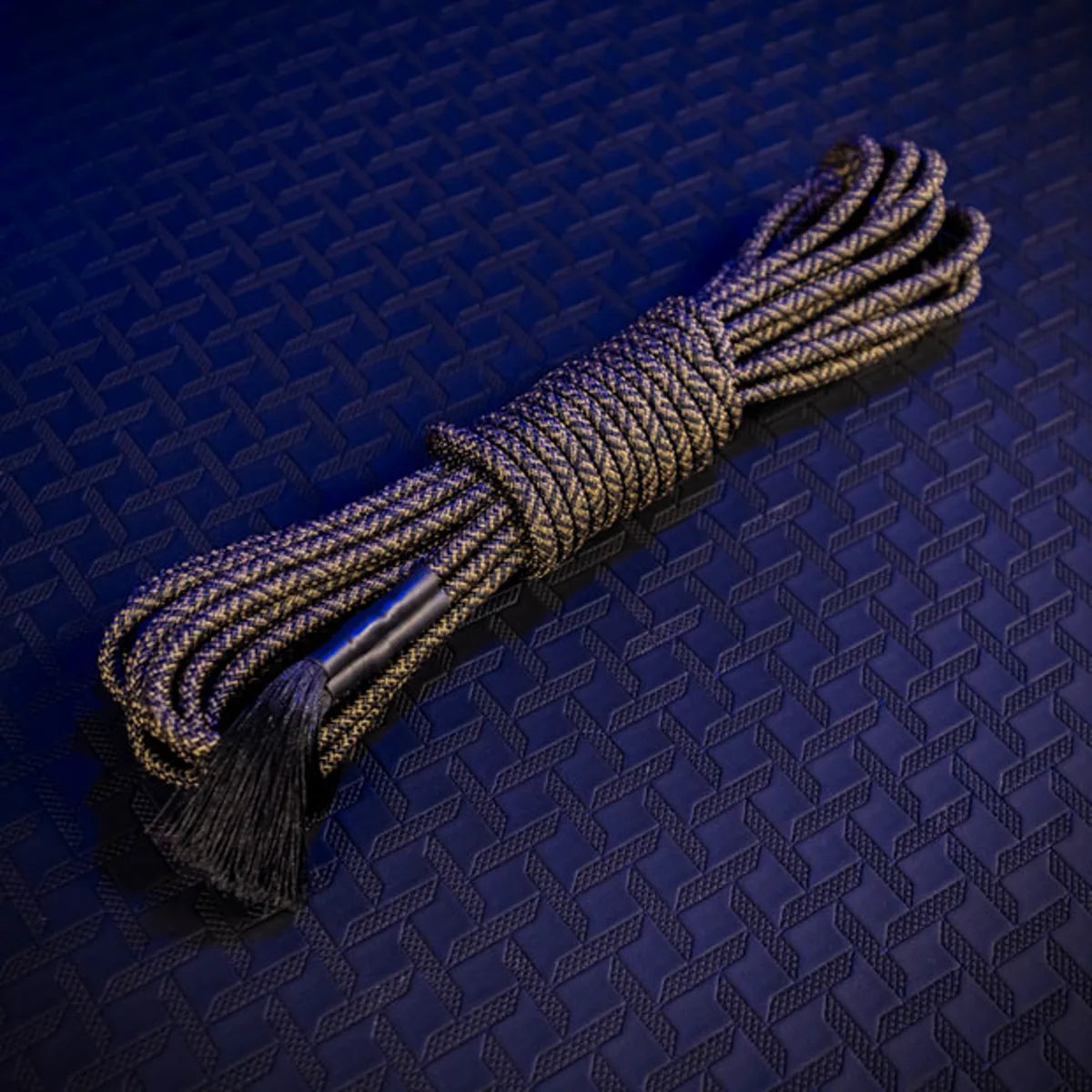 Grunt Rope olive bondage rope coiled with tassels