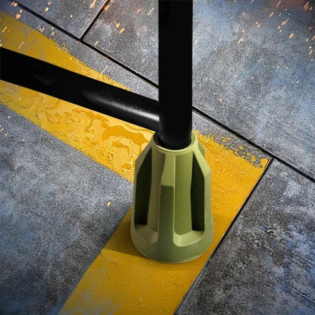 Hammock Hangar sling stand close-up of olive rubber floor foot on a steel leg, Fort Troff