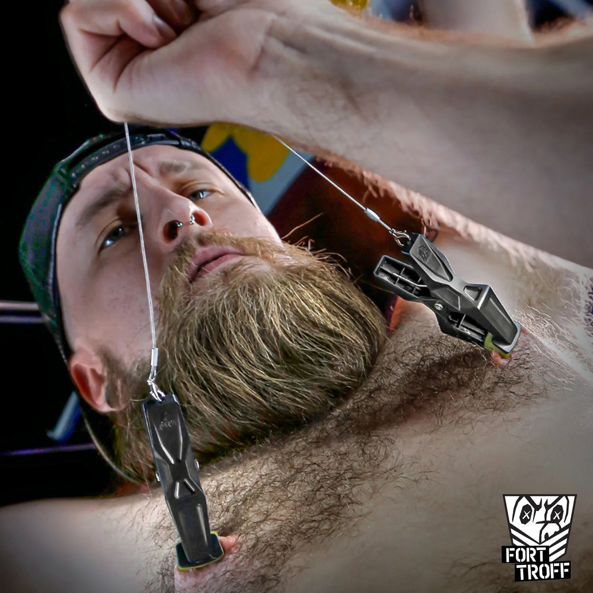 Hardwire Hangers steel cord pulled tight above a bearded model lying on his back, Fort Troff