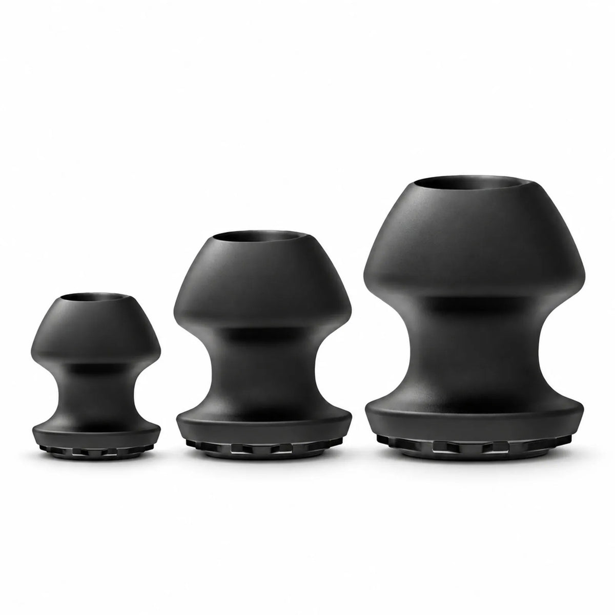 Kum Keeper Hollow Tunnel Butt Plug in Small, Medium and Large, black silicone with open tunnel tops, Fort Troff