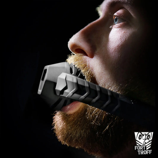 Bearded model wearing the Max Comfort silicone ball gag, side profile, Fort Troff