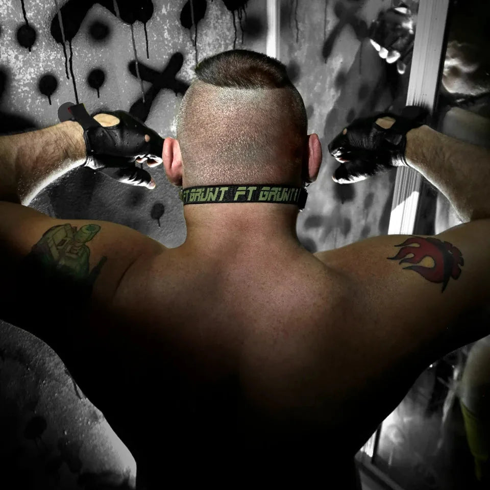 Max Comfort ball gag strap buckled behind a model's head, rear view with Grunt FT print, Fort Troff