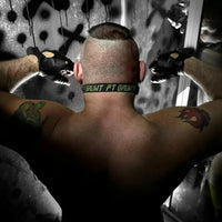 Max Comfort ball gag strap buckled behind a model's head, rear view with Grunt FT print, Fort Troff
