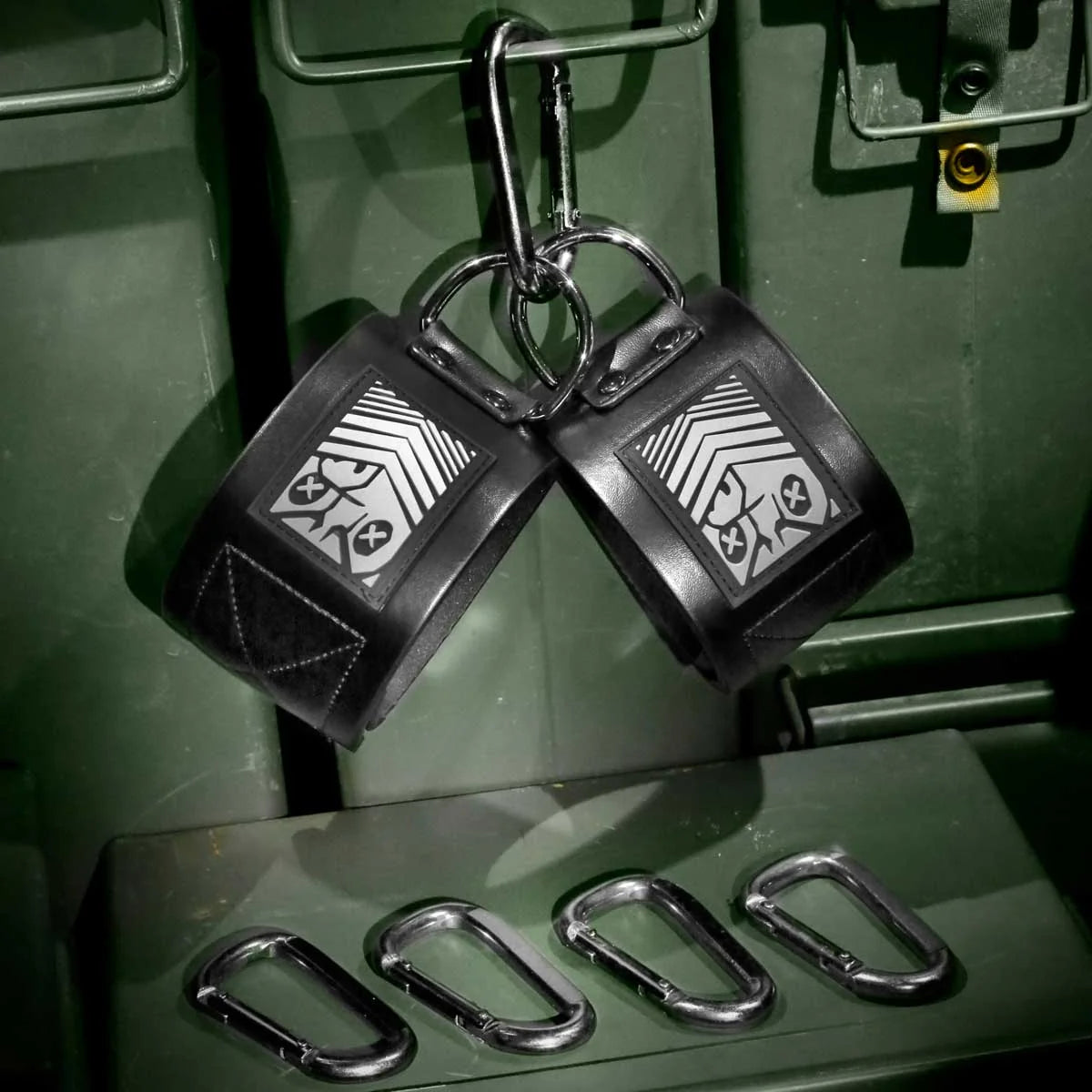 Neo Ankle Restraints pair with steel D-rings and carabiners on an ammo can, Fort Troff