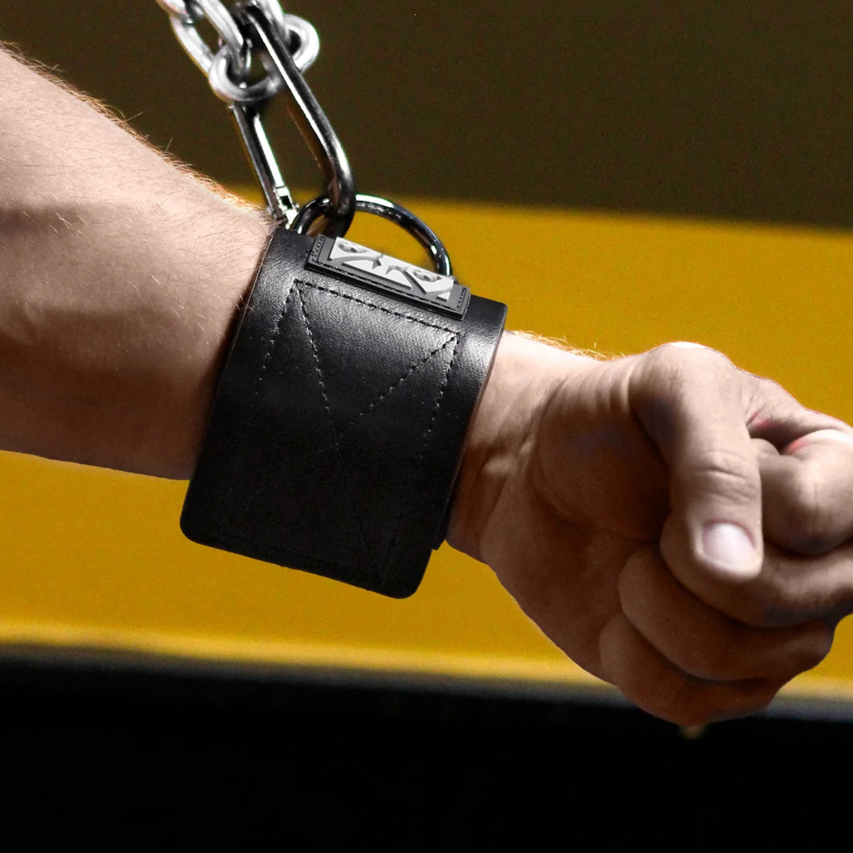 Neo Wrist Restraint on a clenched fist, black neoprene with steel D-ring, Fort Troff