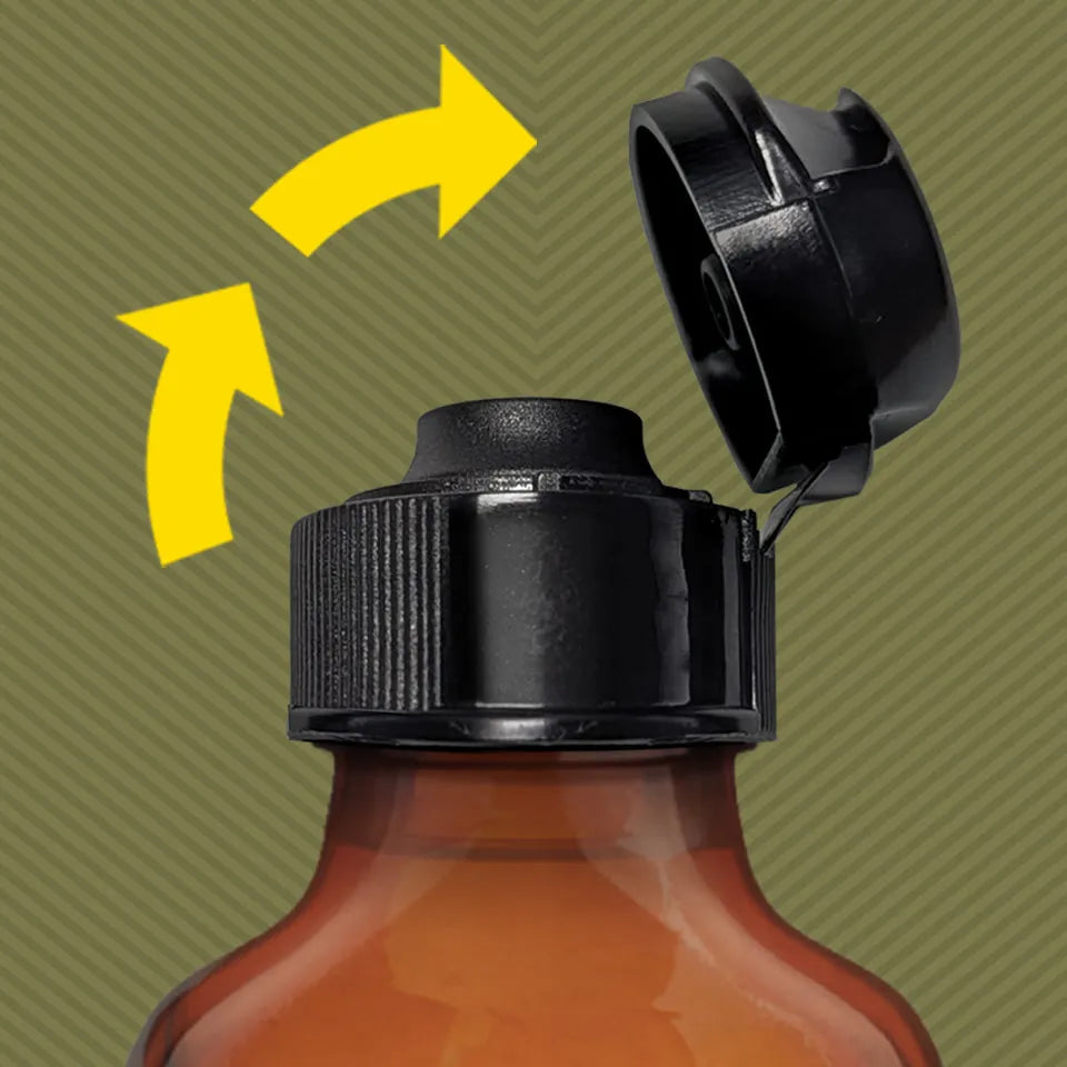 Pig Snout Flip lid snapping open one-handed on an amber essential oil bottle. Fort Troff.
