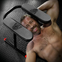 Ready Rimmer rim chair with a bearded model lying beneath the padded seat, looking up, Fort Troff