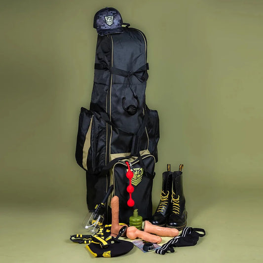 Rolling Sling Travel Bag standing upright with sling, boots, toys and gear laid out beside it, Fort Troff