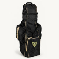 Rolling Sling Travel Bag standing upright, black ballistic nylon with tan trim and shield logo pocket, white background, Fort Troff