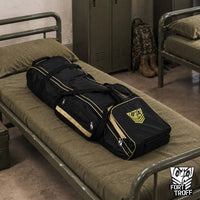 Rolling Sling Travel Bag packed and lying on a barracks cot, Fort Troff
