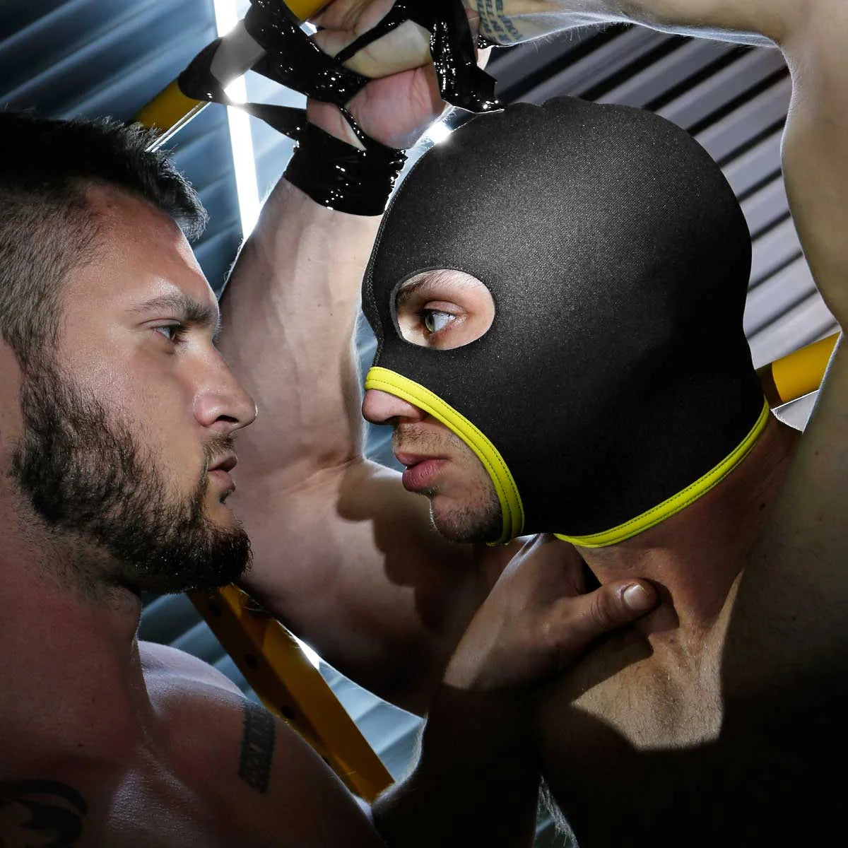 Skullfuck open-mouth hood in yellow on a model face to face with a partner, Fort Troff