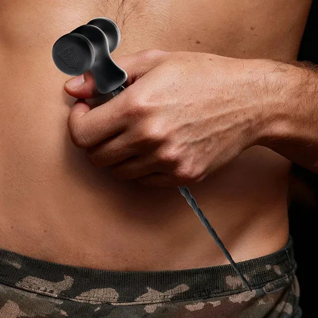 Sounding Hammer T-handle sound held at the waist of a model in camo briefs, Fort Troff