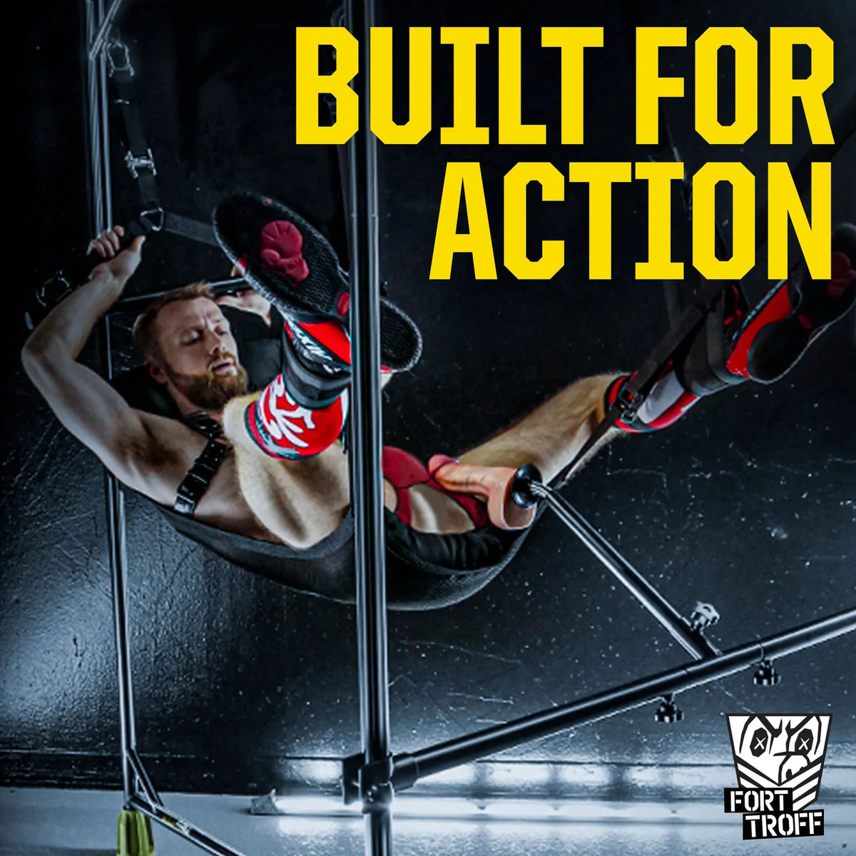 Spring Fuk Bar Built For Action shot, bearded model in a sling riding a dong mounted on the bar, Fort Troff