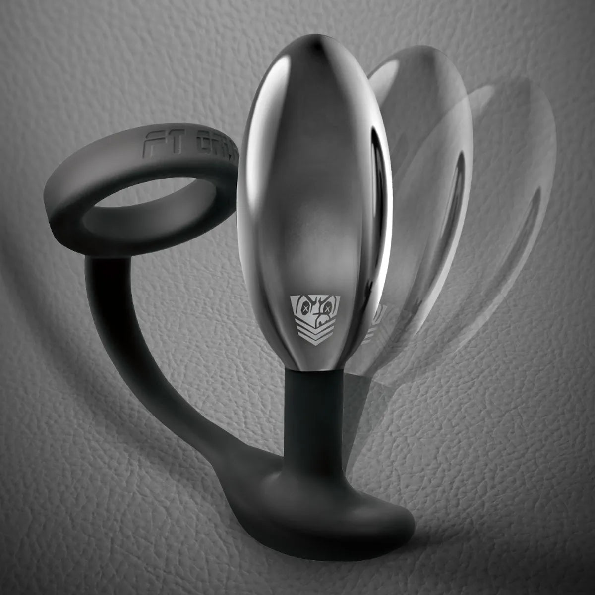 Silicone cock ring attached by a curved stem to a polished metal butt plug
