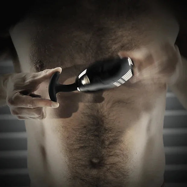 Spring Loaded metal butt plug side profile showing the silicone-coated spring stem. Fort Troff.