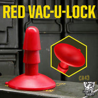 Red Vac-U-Lock Suction Cup Base standing on an ammo box with a suction cup inset, Fort Troff