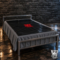 Waterproof PVC Playsheet in black with red logo spread over a bed on a steel frame, Fort Troff
