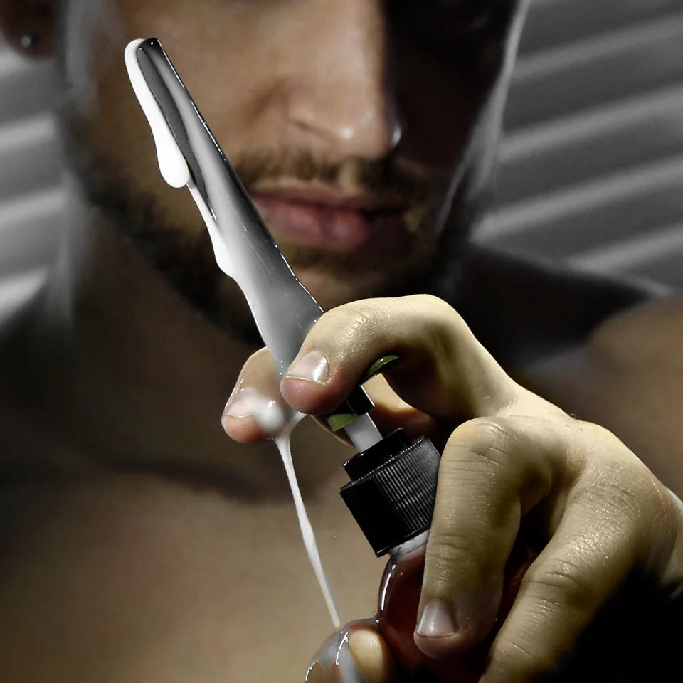 Artillery Flex Shooter lube applicator pumping a stream of lube from a bottle, Fort Troff