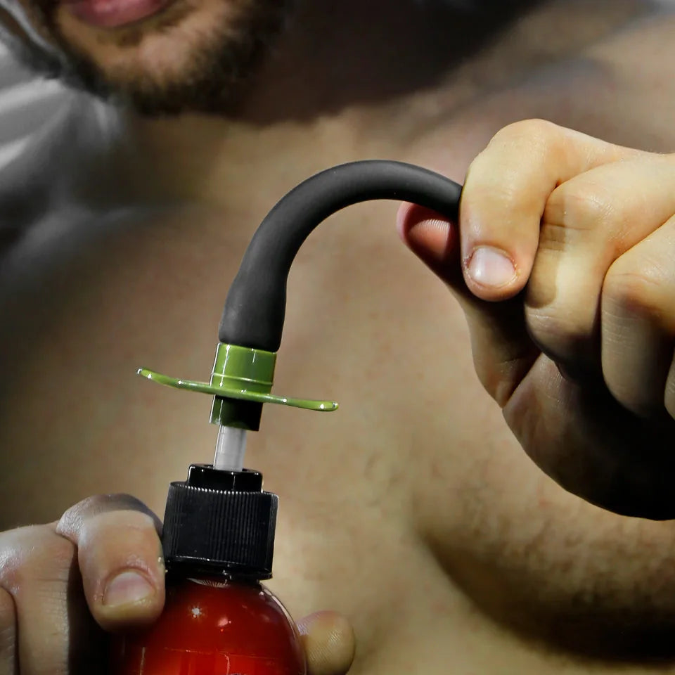 Artillery Flex Shooter flexible silicone nozzle bending in hand on a lube bottle, Fort Troff