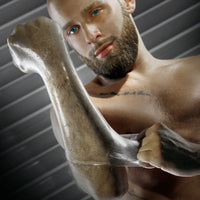 Bearded model holding up an arm sheathed in the FFister Frost fisting sleeve, Fort Troff