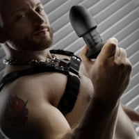 Robo Rimmer Slim plug held up by a bearded model in a chain harness, Fort Troff