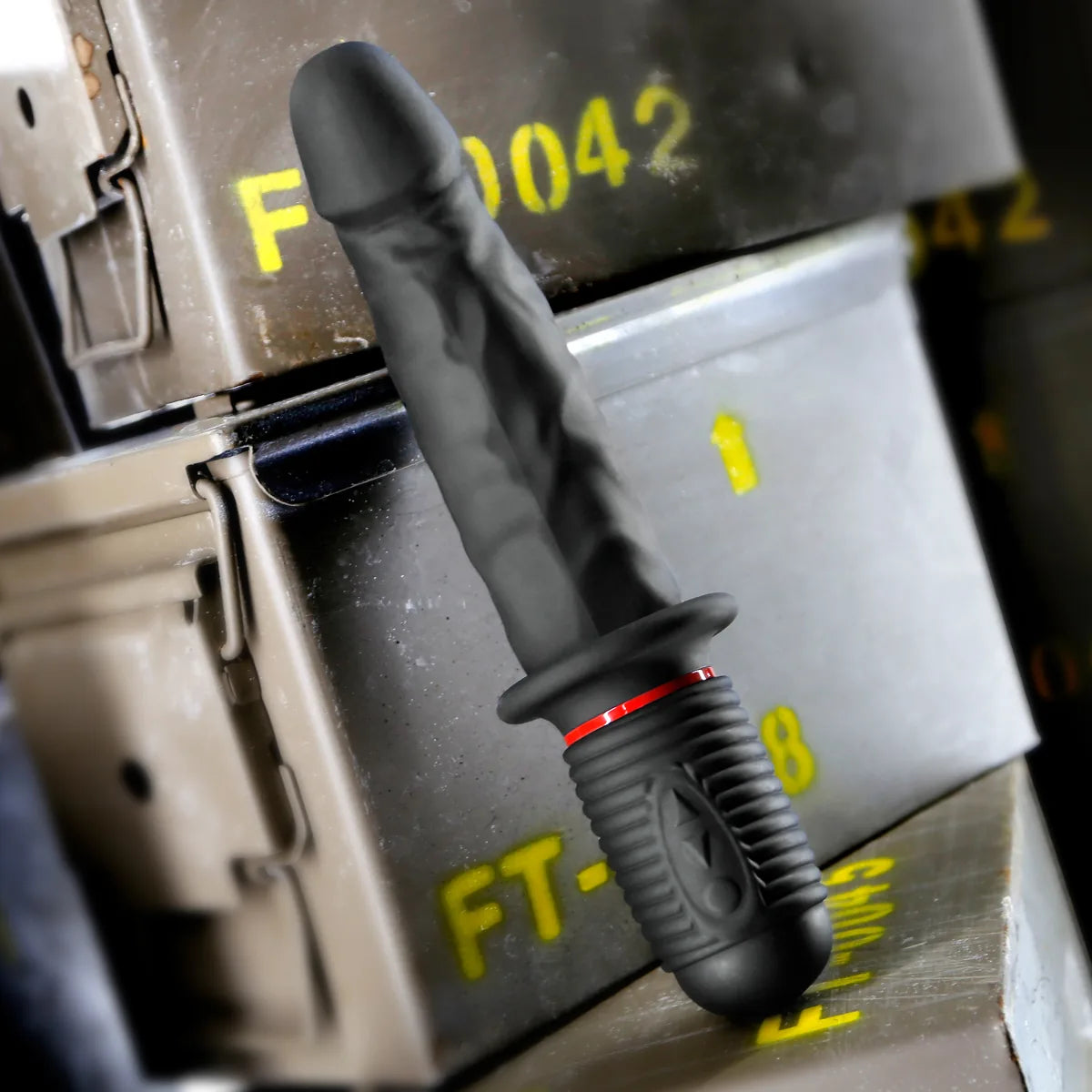 Jackhammer Cock vibrating thrusting dildo in black silicone with grip handle, standing on olive ammo cans, Fort Troff